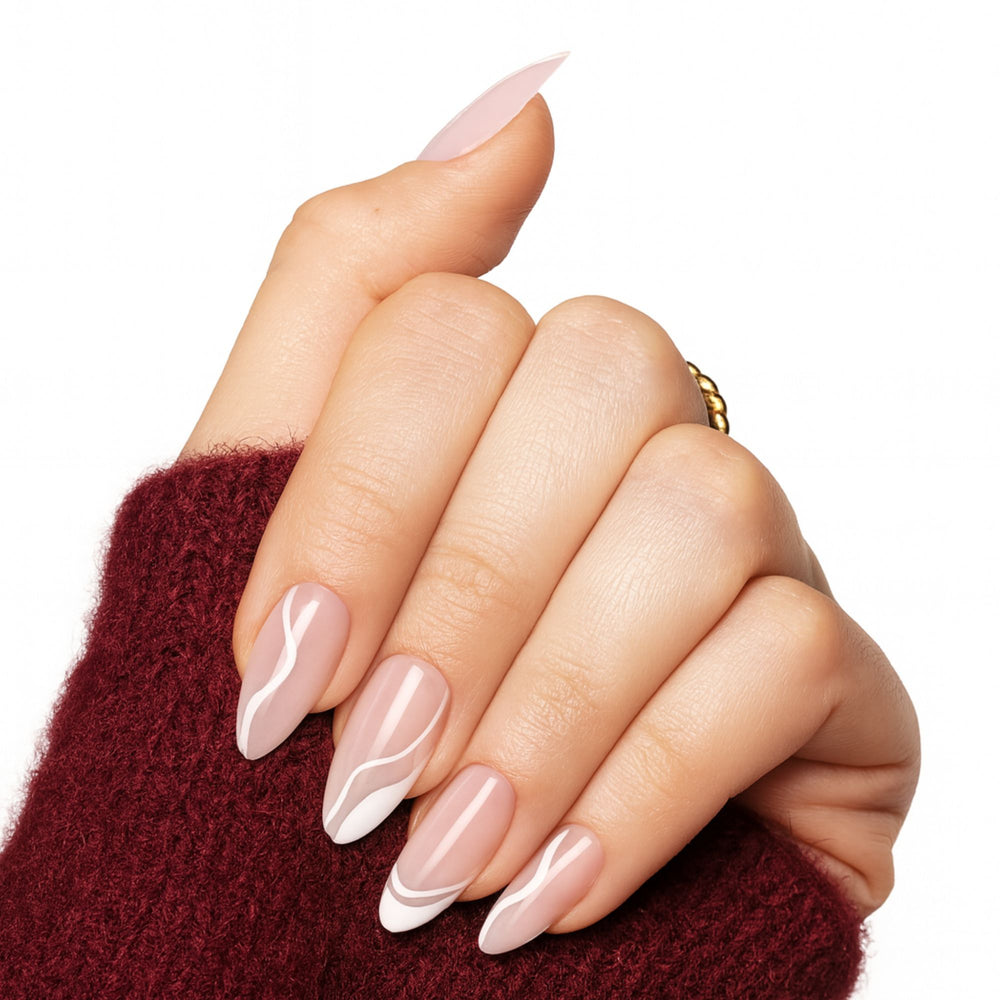 Nude press on nagels met witte abstracte swirls. Soft Swirl van Freaky Nails.